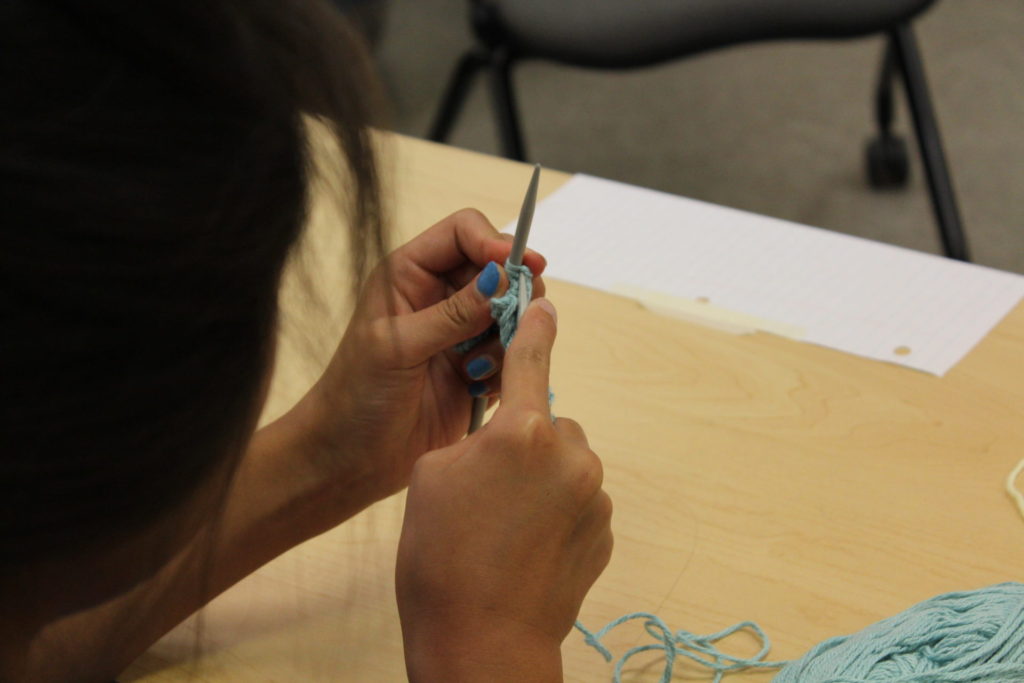 child learning to knit