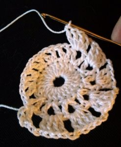 The beginnings of a crochet lace circle