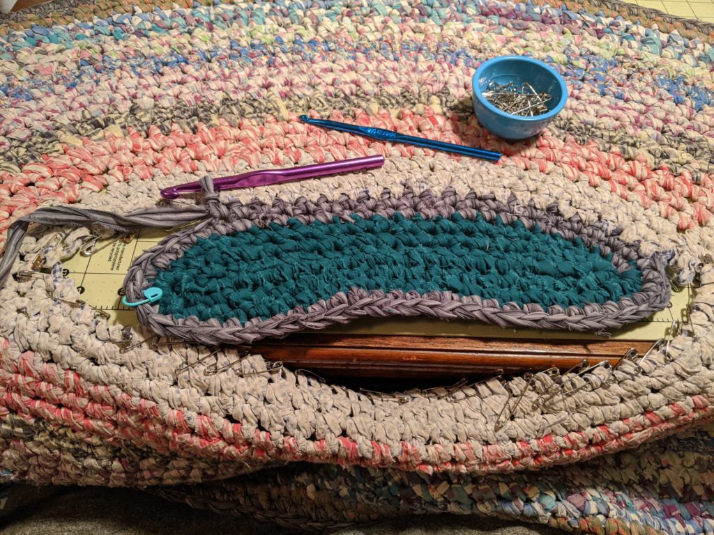 crochet rag rug with center being re-inserted